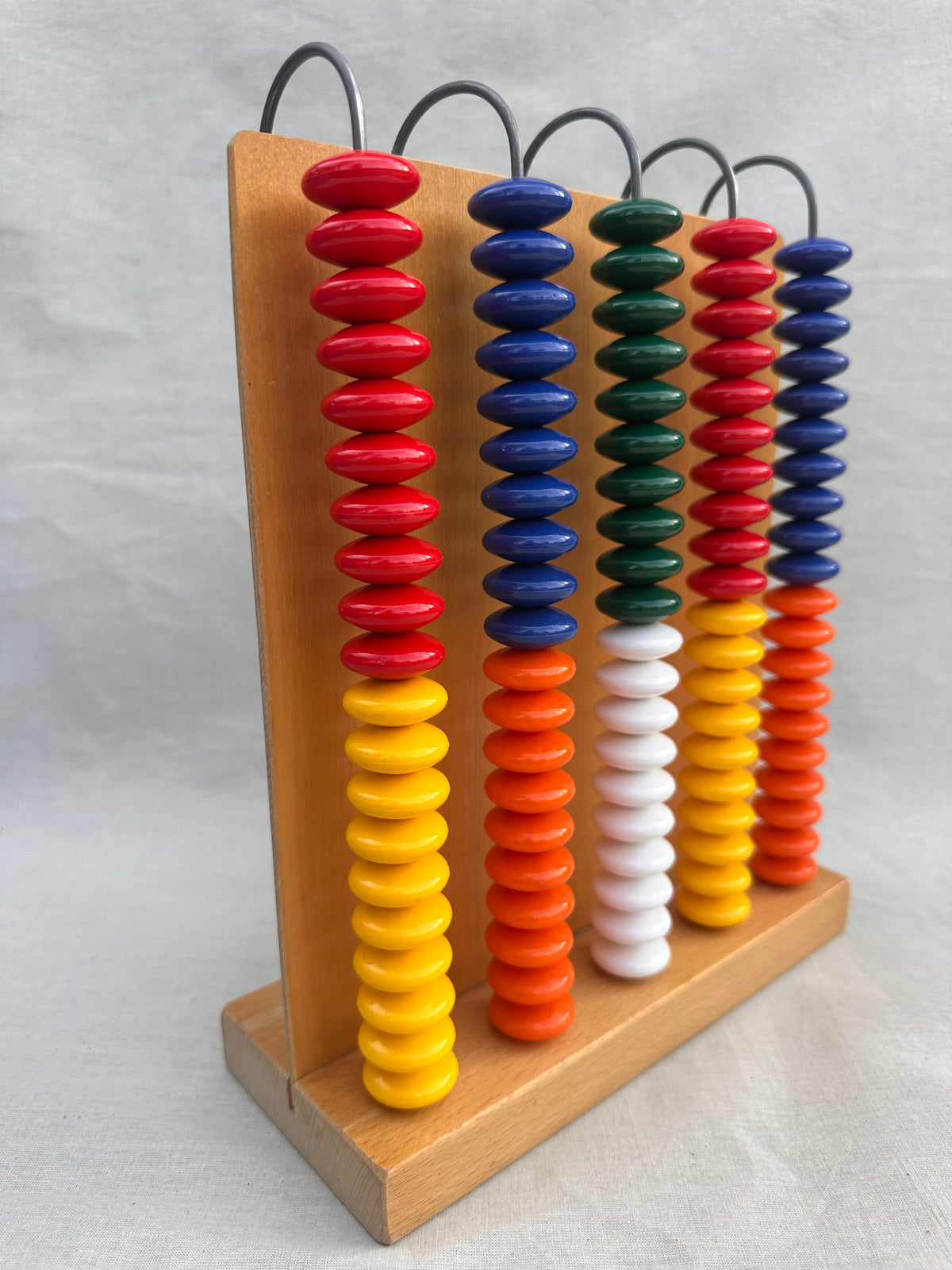 Vintage wooden abacus with yellow, green, orange, blue, yellow, white and red beads
